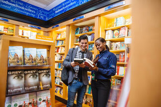 Hudson booke sellers - employee helping a customer 