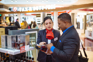 Customer and Employee at a Duty Free store 